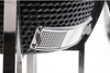 Close-up of the adjustable lower airflow vent on the black KoKoMo ceramic Kamado grill