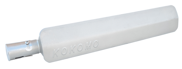 Close-up of a metal grill burner embossed with the KoKoMo name