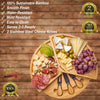 Rotating bamboo charcuterie board arranged with cheese and fruit for home entertaining