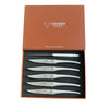 Six Laguiole en Aubrac matte stainless steel steak knives arranged in an open brown presentation box with a black fitted insert