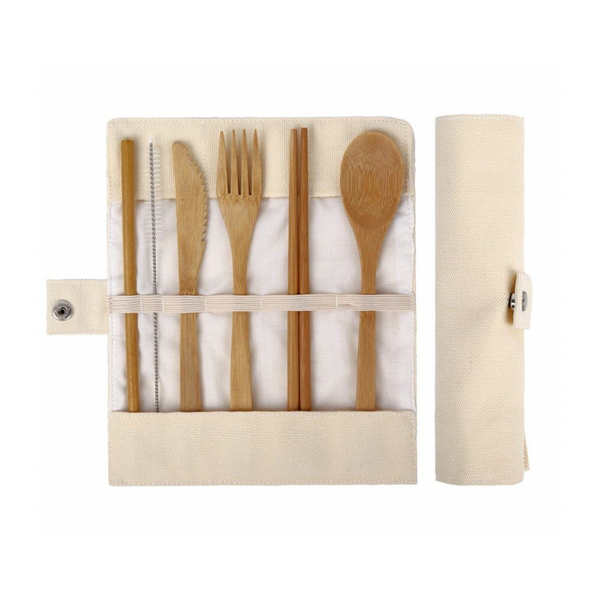 Set of bamboo cutlery including knife, fork, and spoon in a fabric case on a white background