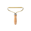Gold metal roller with wooden handle on a white background