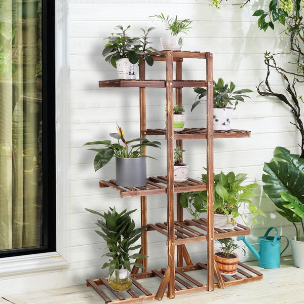Six-tier indoor plant shelf holding various potted plants, showcasing heavy-duty weight-bearing design