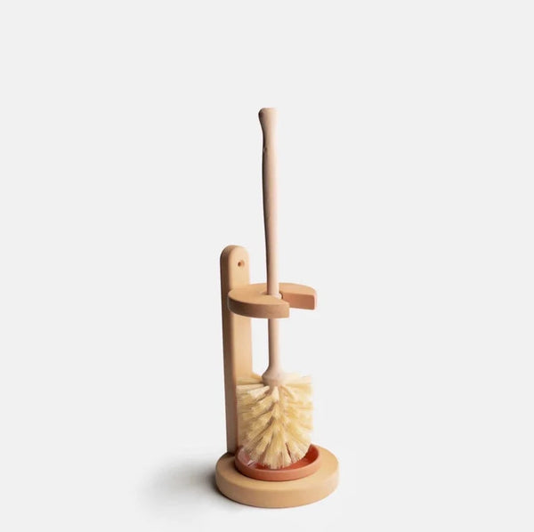Close-up of stiff natural sisal bristles and sustainable wood handle of plastic-free toilet brush