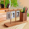 Sustainable wood desk organizer styled with pens and accessories, perfect eco-friendly gift for professionals