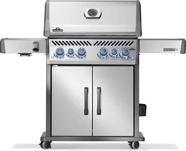 Napoleon Rogue PRO-S 525 stainless steel gas grill with closed lid, side shelves and blue-lit control knobs