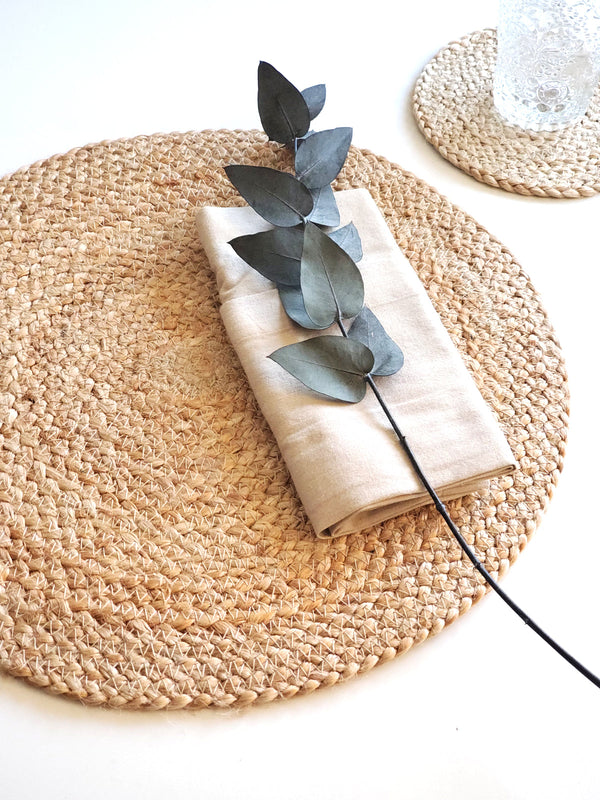 "Minimalist dining setting featuring Kara natural placemats and ceramic plates"
