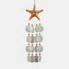 Close-up of translucent natural capiz shell strands on a bohemian-style wind chime