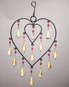 13-inch handcrafted heart chime bell hanging against a wall, artisan wall art for sanctuary spaces