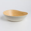 Bowl with wooden interior and white exterior on a light gray background