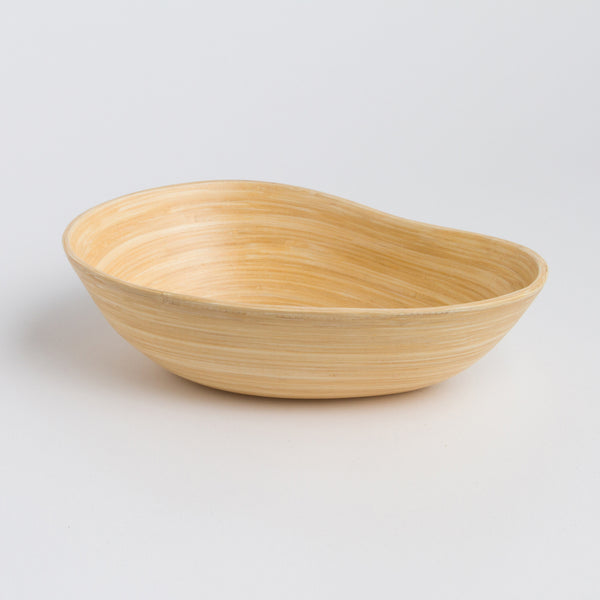 Close-up of functional pouring spout on SOAI artisan bamboo bowl, sustainable fair trade serveware."
