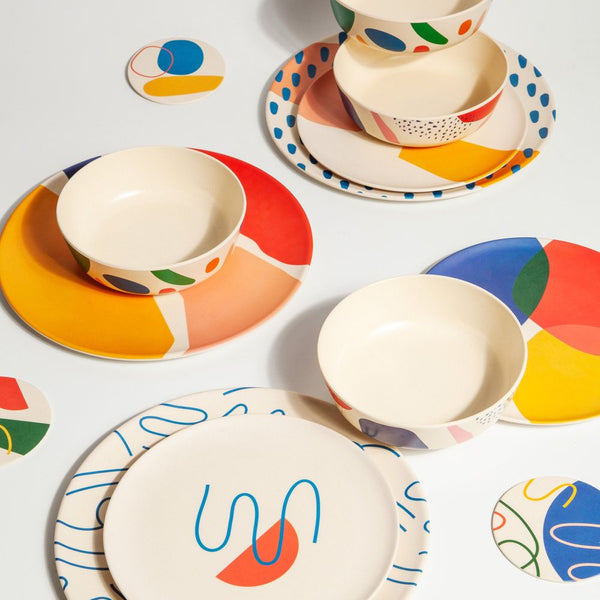 Bamboo plate set styled on dining table, lightweight and sustainable 4-piece dinnerware