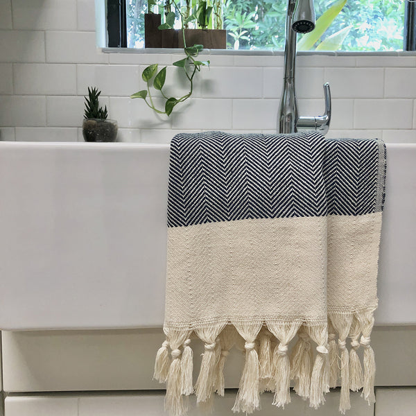 Close up of hand-knotted fringe detail on organic cotton Turkish towel