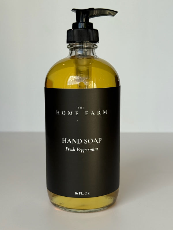 Organic Botanical Hand Soap in a 16oz glass jar on a bathroom vanity