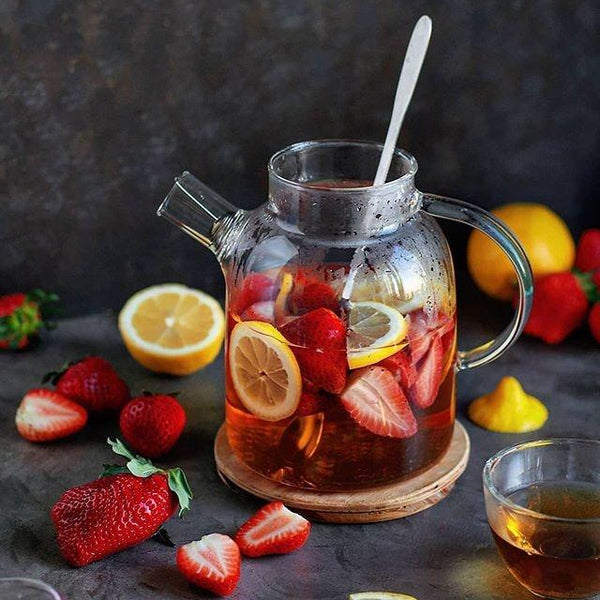 Thermo Glass Teapot filled with blooming herbal tea"