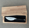 Laguiole en Aubrac ebony-handled pizza knife in an open wooden presentation box with a fitted black insert