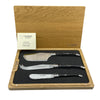 Laguiole en Aubrac three-piece ebony-handled cheese knife set in an open wooden presentation box with an authenticity certificate