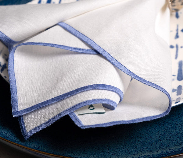 Chouchou Touch white linen napkins with blue satin-stitch edges, set of 4, view 4