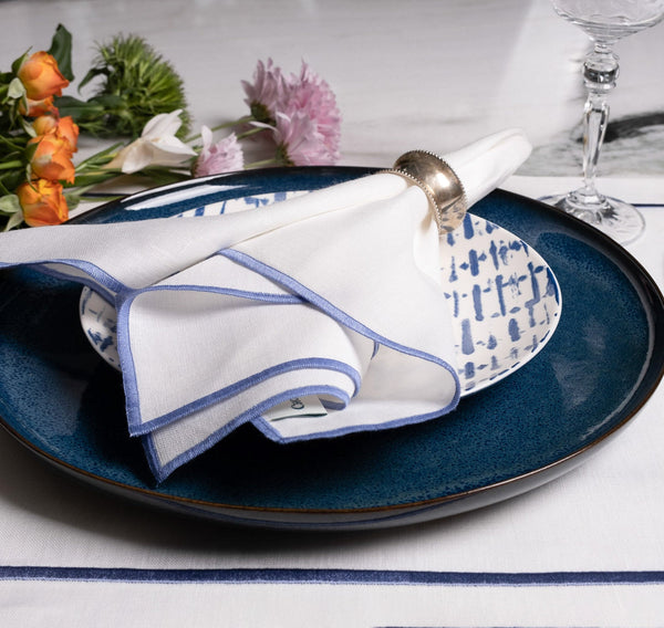 Chouchou Touch white linen napkins with blue satin-stitch edges, set of 4, view 3