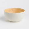 Bowl with wooden interior and white exterior on a light gray background