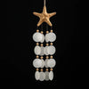 Handcrafted capiz shell chime styled in a meditation corner, calming sound decor for sanctuary spaces