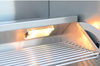 Close-up of an illuminated interior lamp above the KoKoMo grill warming rack