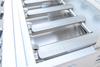 KoKoMo grill interior showing metal burners with the cooking grates removed
