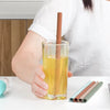 Reusable silicone straws in iced coffee and smoothie glasses, sustainable eco-friendly drinkware