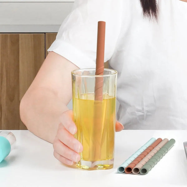 Reusable silicone straws in iced coffee and smoothie glasses, sustainable eco-friendly drinkware