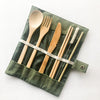 Close-up of bamboo fork, spoon, knife, chopsticks, and straw with wire cleaner brush