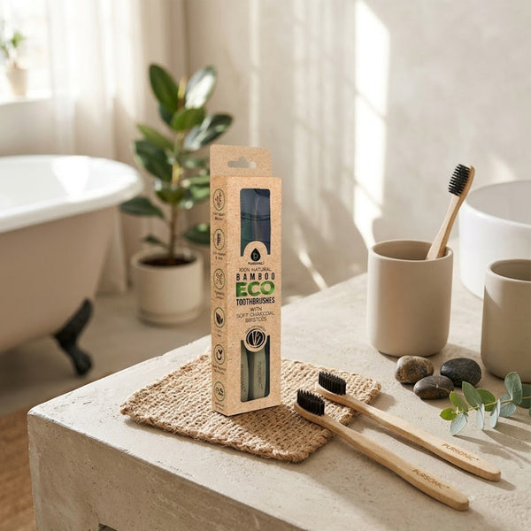 "Natural bamboo toothbrush resting on a clean bathroom counter