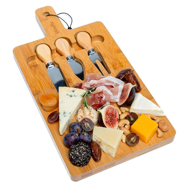 Bamboo cheese board set arranged with charcuterie and fruit for intimate entertaining