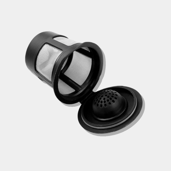 Close-up of durable stainless steel mesh filter on a reusable Keurig compatible coffee pod