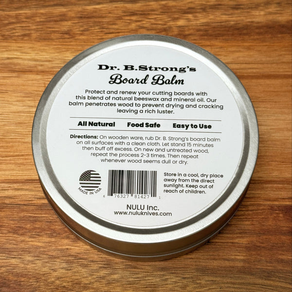 Back label of Dr. B.Strong’s Board Balm tin showing application directions, storage instructions and beeswax and mineral oil ingredients