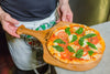 Close-up of laser-engraved Frederica Trading logo on sturdy bamboo pizza peel handle