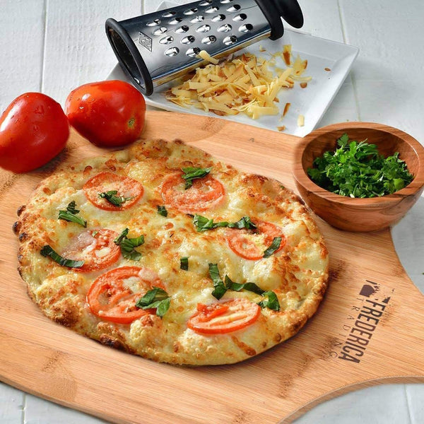 Bamboo pizza peel with a fresh artisanal pizza, heat-resistant wooden kitchen tool