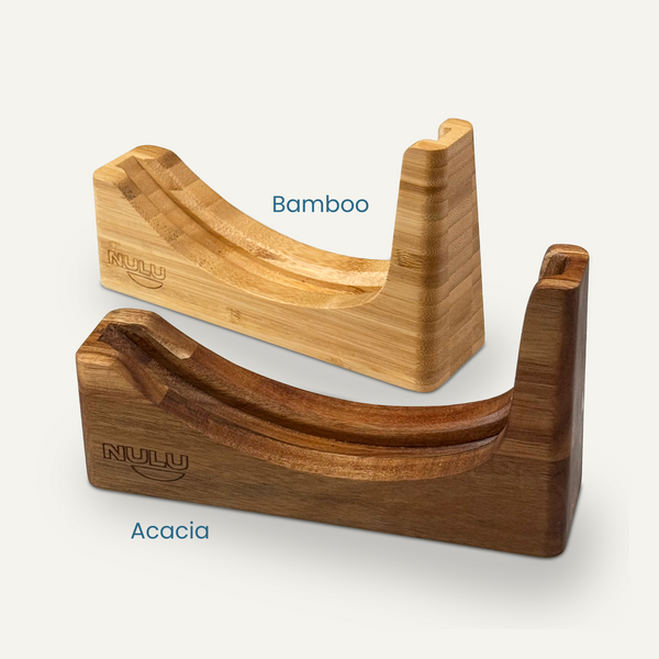 NULU bamboo and acacia knife docks shown together, with curved blade-storage grooves and engraved logos