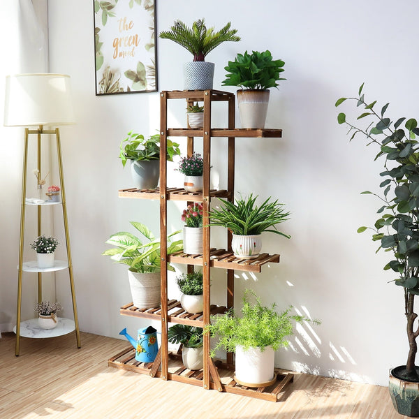 Six-tier indoor plant shelf holding various potted plants, showcasing heavy-duty weight-bearing design