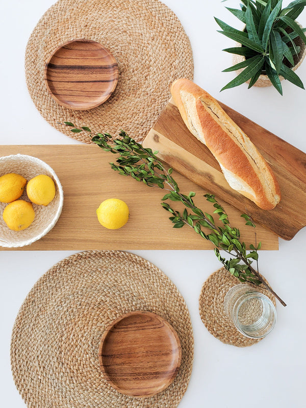 Set of 4 Kara natural woven placemats on adining table"