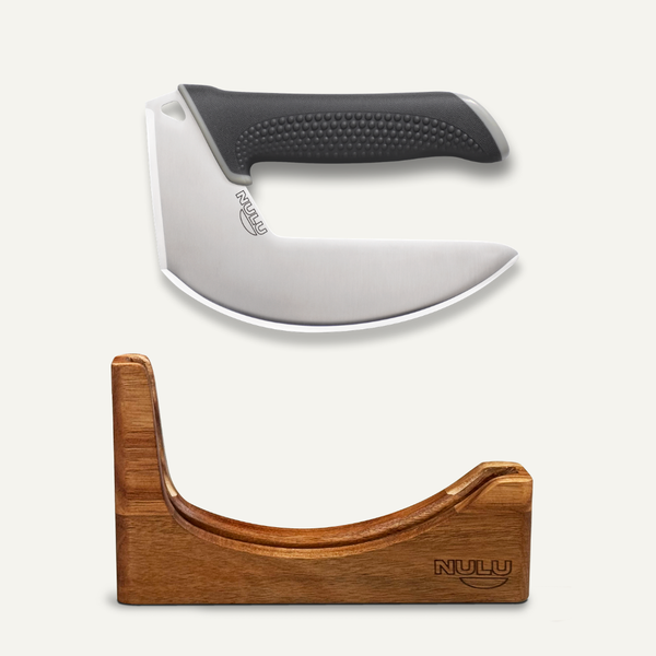 NULU curved stainless steel kitchen knife with a black textured handle displayed above an acacia wooden dock