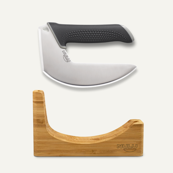 NULU curved stainless steel kitchen knife with a black textured handle displayed above a bamboo dock