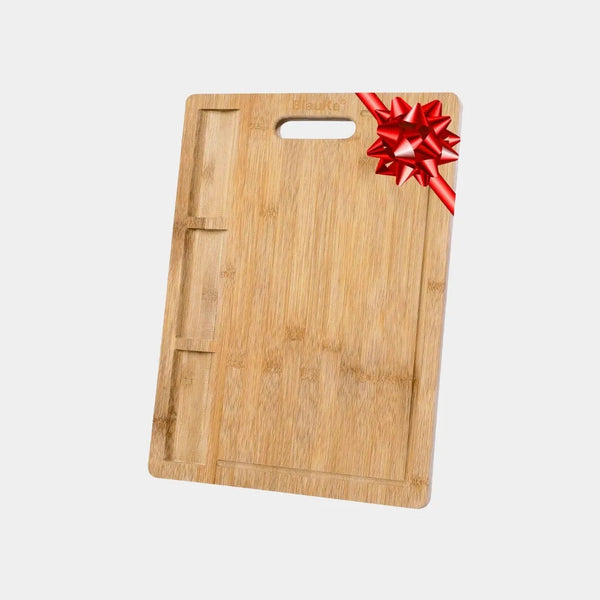 Close-up of 3 built-in ingredient compartments on bamboo cutting board for organized meal prep