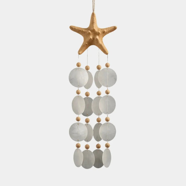 Close-up of translucent natural capiz shell strands on a bohemian-style wind chime