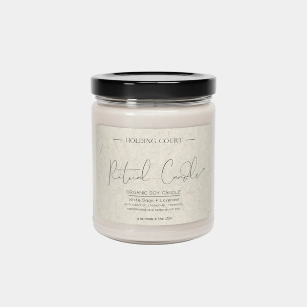 Ritual organic soy candle styled in a bedroom for meditation and self-care stress relief