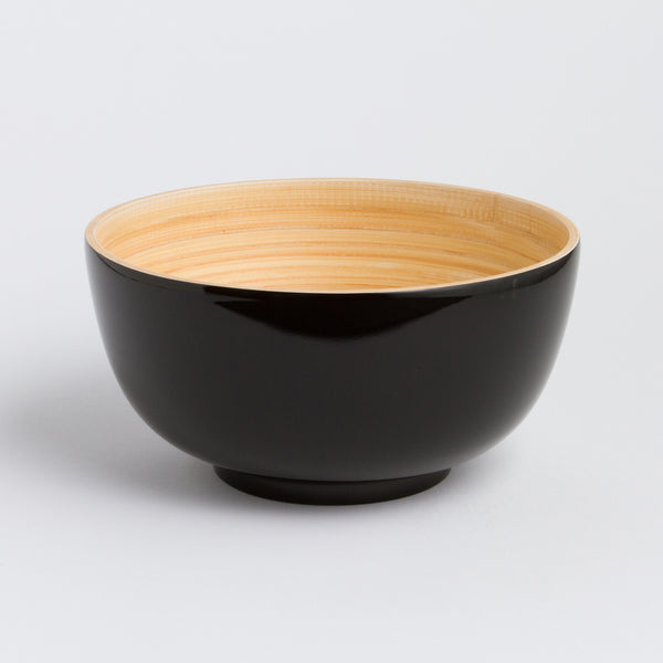 Black and beige bowl on a light gray background