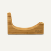 “Front view of an empty bamboo NULU knife dock with a curved blade slot and engraved logo.”