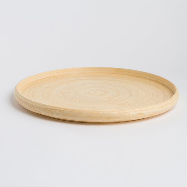 Round wooden Bamboo Tray on a light gray background