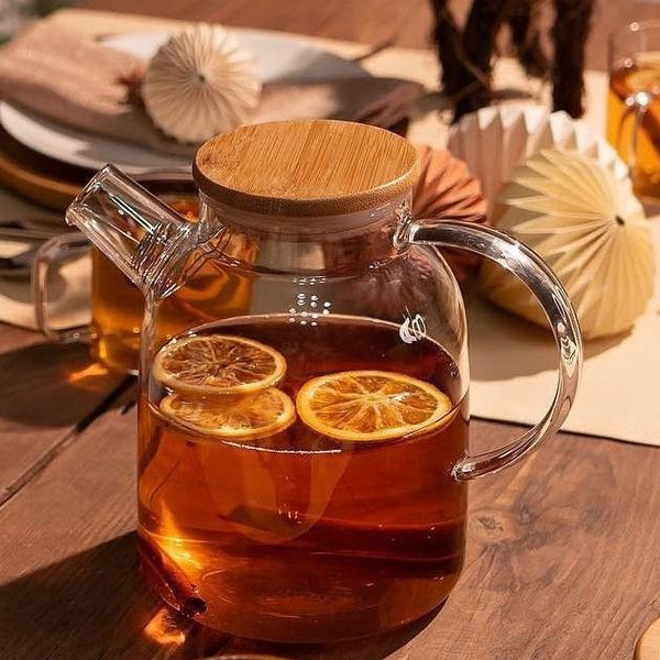 Minimalist glass teapot with iced teain a sunlit kitchen