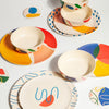 Bamboo plate set styled on dining table, lightweight and sustainable 4-piece dinnerware