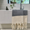Close up of hand-knotted fringe detail on organic cotton Turkish towel
